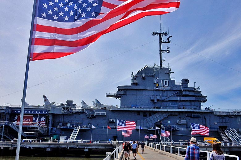 Walk the alley of flags to the USS Yorktown at Patriots Point