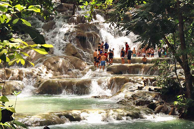 People enjoying the waters of Dunn's Falls, Jamaica