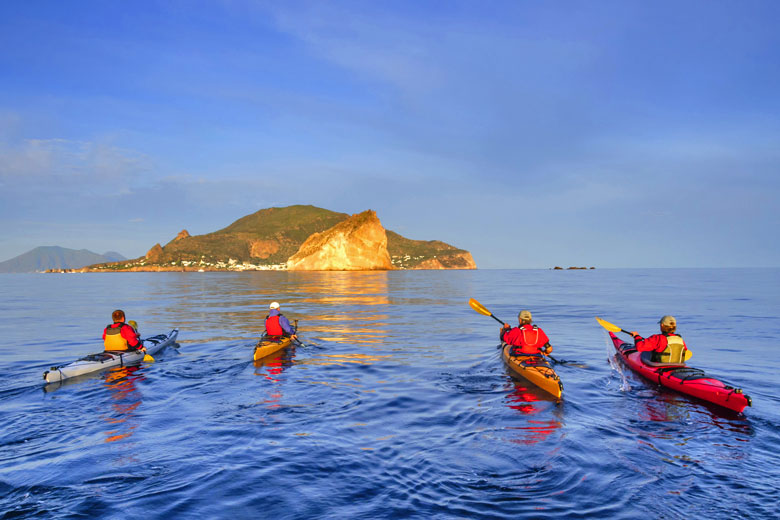 Early morning paddle in the Aeolian islands, Sicily Early morning paddle in the Aeolian islands, Sicily