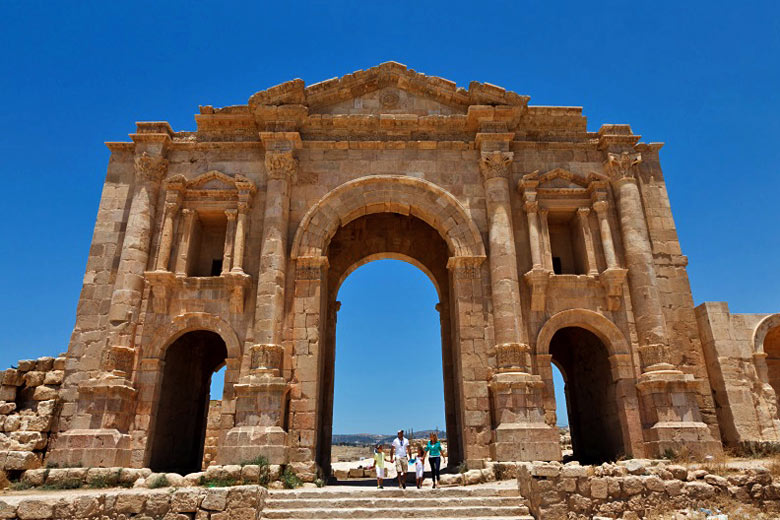 Passing under Hadrian's Arch at the ruins of Jerash