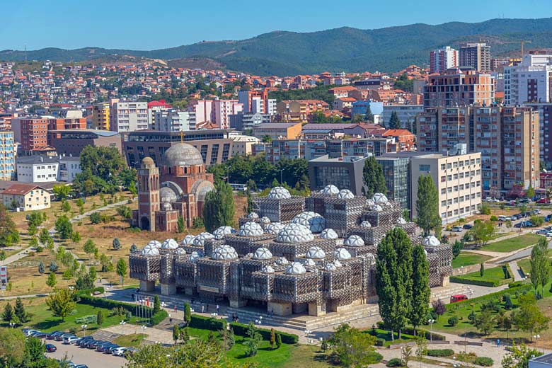 National Library of Kosovo with the Serbian Orthodox cathedral beyond