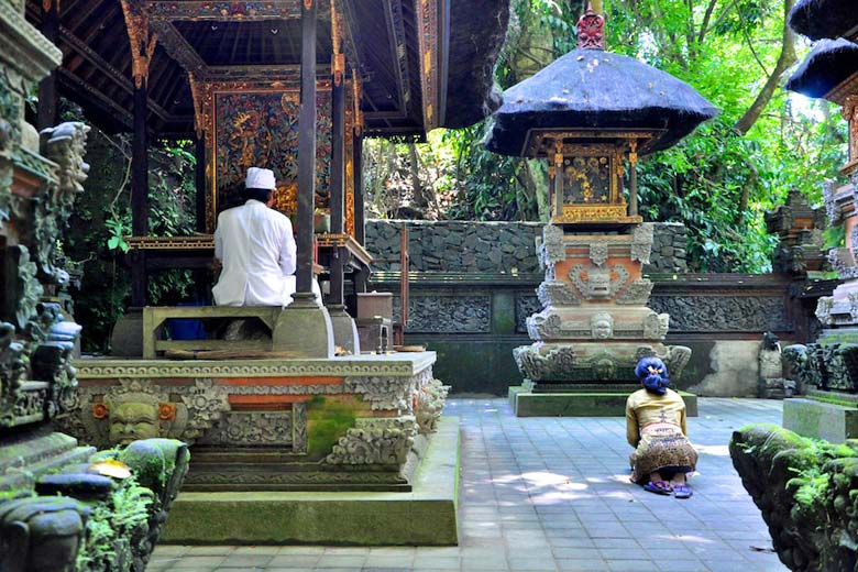 Priest (in white) at Monkey Forest temple
