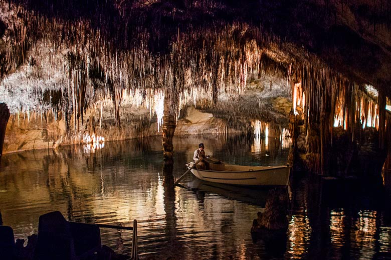 Paddling the subterranean lake in the Caves of Drach