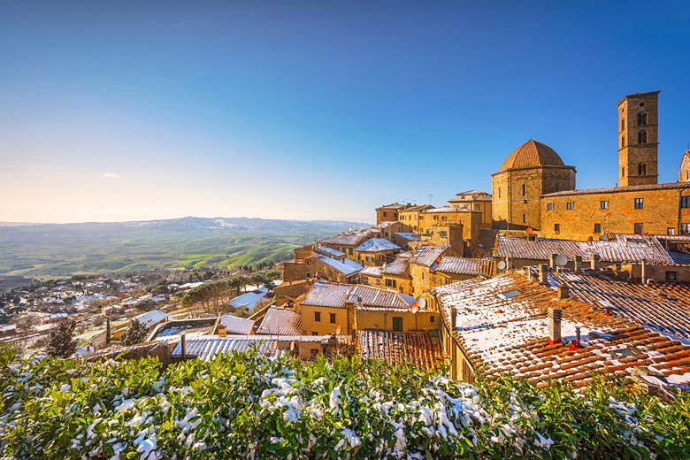 Snow-dusted rooftops of Volterra, Tuscany, Italy
