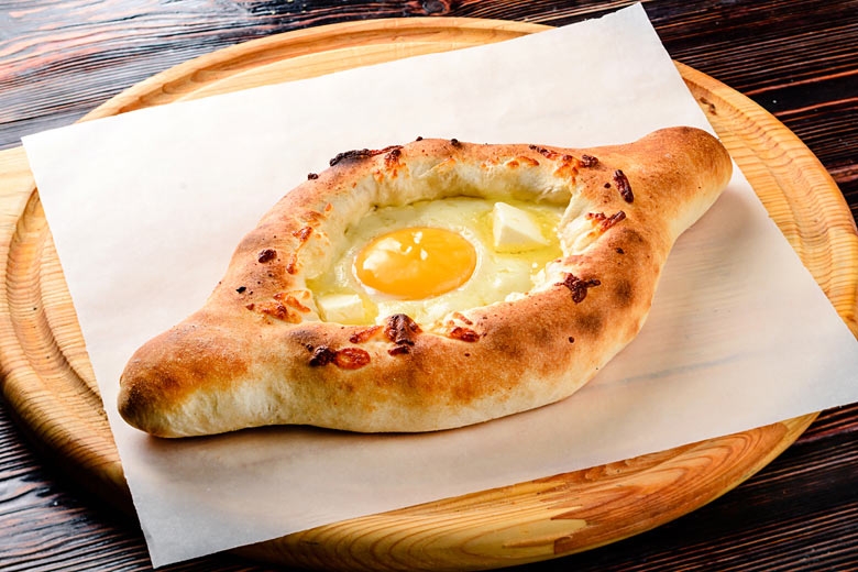 Georgia's indulgent adjarian khachapuri Georgia's indulgent adjarian khachapuri
