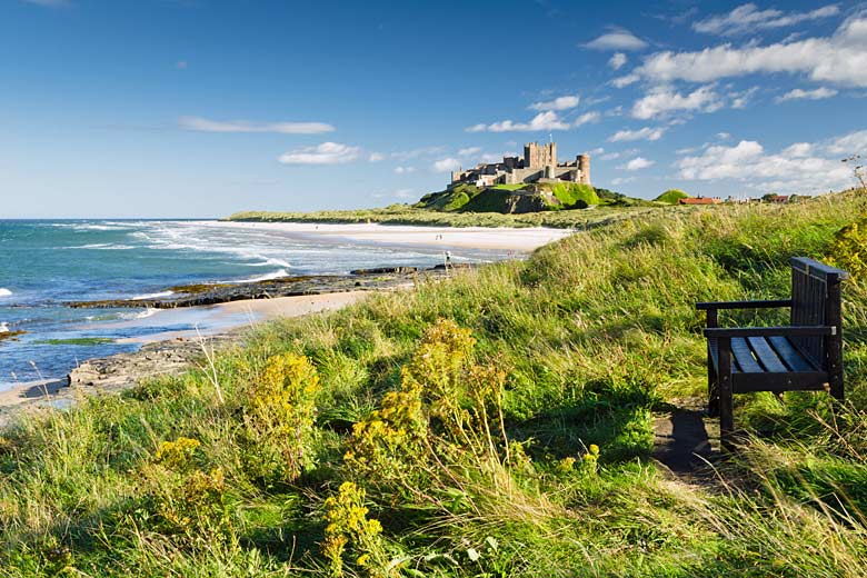 Dramatic Bamburgh Castle on the wild Northumberland coast Dramatic Bamburgh Castle on the wild Northumberland coast