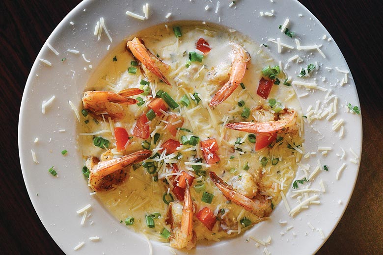 Cajun shrimp and grits, a southern staple Cajun shrimp and grits, a southern staple