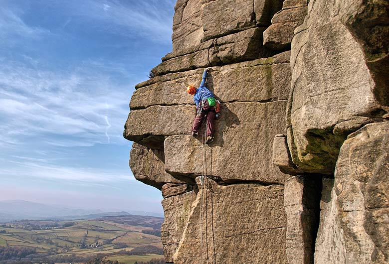 Climbing the sheer face of Stanage Edge