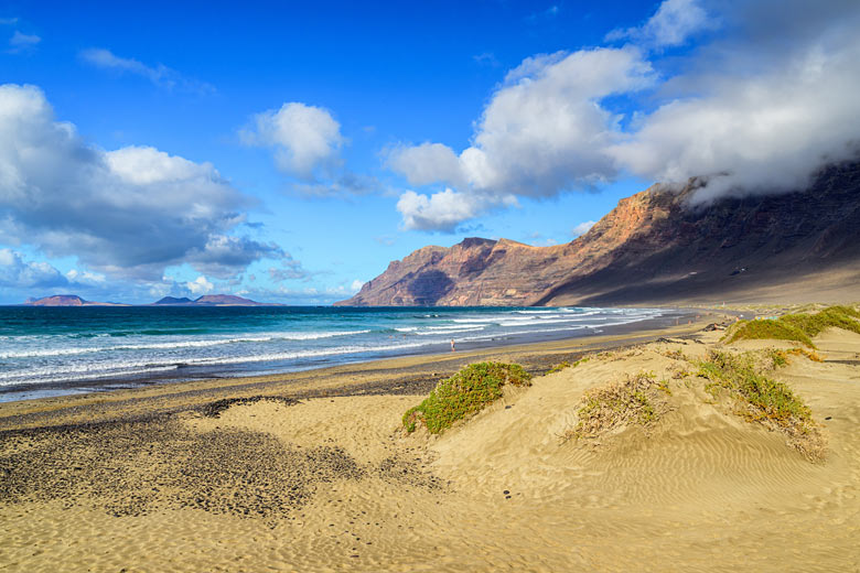 The wild shores of Famara Beach, Lanzarote The wild shores of Famara Beach, Lanzarote