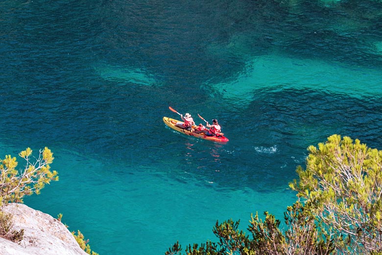Kayaking off the coast of Menorca Kayaking off the coast of Menorca