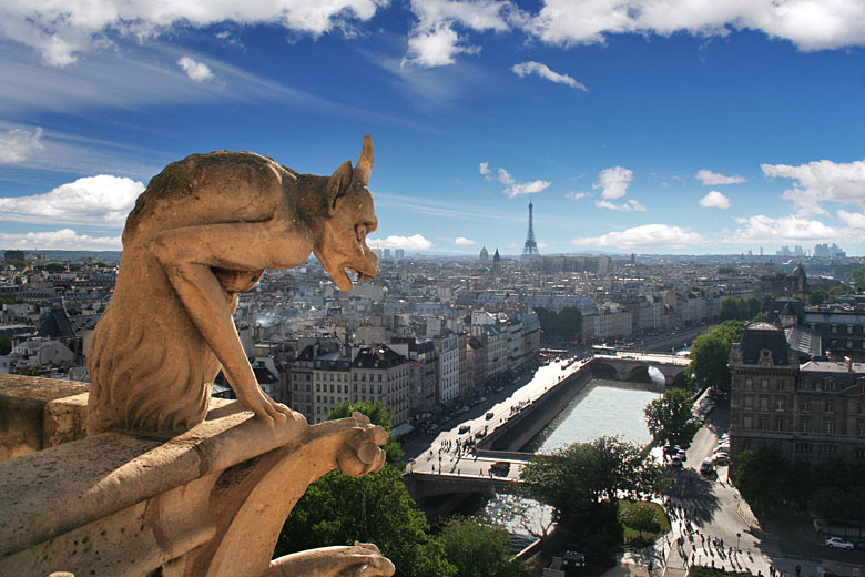 Gargoyle of Notre Dame Cathedral watching out over Paris