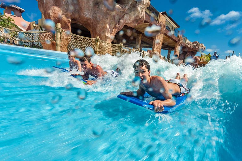 Kids on the surf simulator machine at Beaches Turks & Caicos Kids on the surf simulator machine at Beaches Turks & Caicos