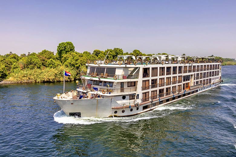 Nile river cruise ship heading for Aswan in Egypt Nile river cruise ship heading for Aswan in Egypt