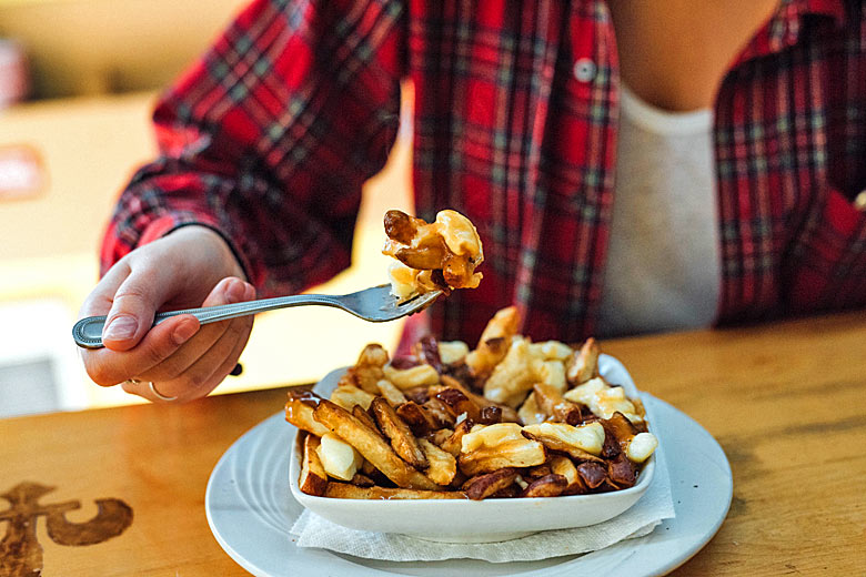 Get stuck into an indulgent city favourite - poutine © Alison Slattery - courtesy of Tourisme Montréal Get stuck into an indulgent city favourite - poutine © Alison Slattery - courtesy of Tourisme Montréal