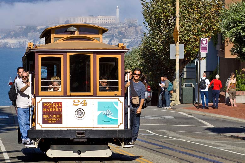 Riding a cable car in San Francisco Riding a cable car in San Francisco
