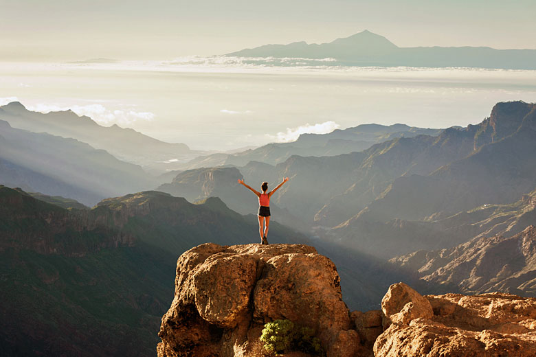 Standing on the summit of Roque Nublo, Gran Canaria