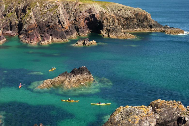 Sea kayaks exploring the coast