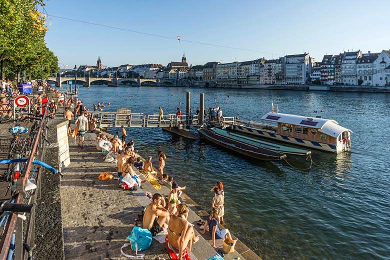 Swimmers making the most of the Rhine in summer Swimmers making the most of the Rhine in summer