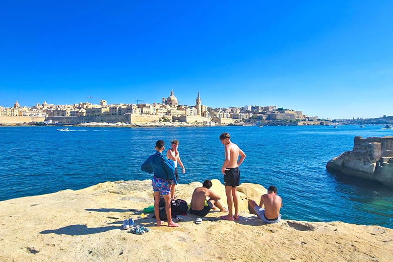 Swimming off the rocks in Sliema, Malta