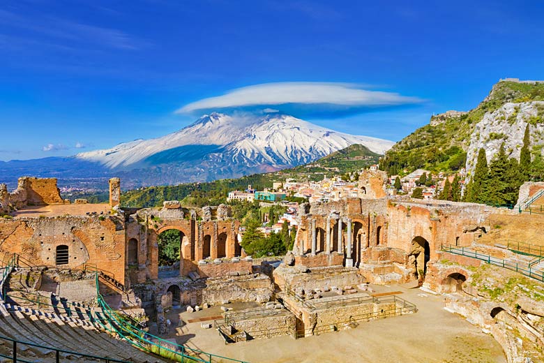 The ancient Greek theatre of Taormina with snow-capped Mount Etna beyond © IgorZh - Fotolia.com