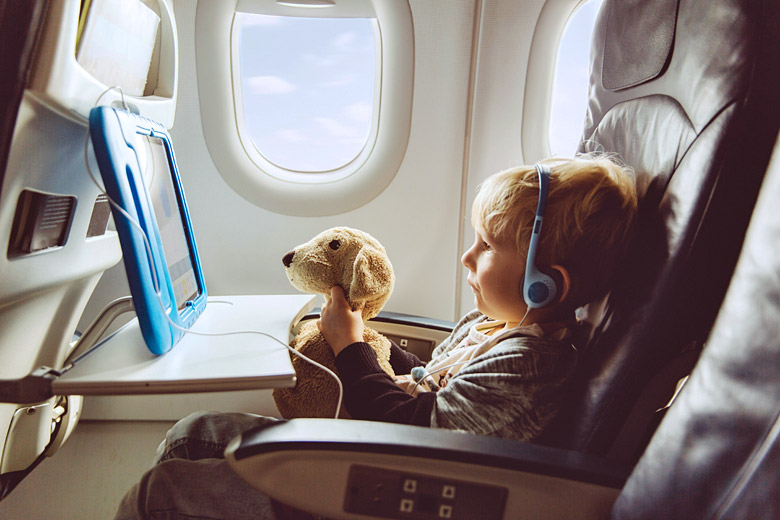 Today's long haul flights are packed full of entertainment © Westend61 GmbH - Alamy Stock Photo