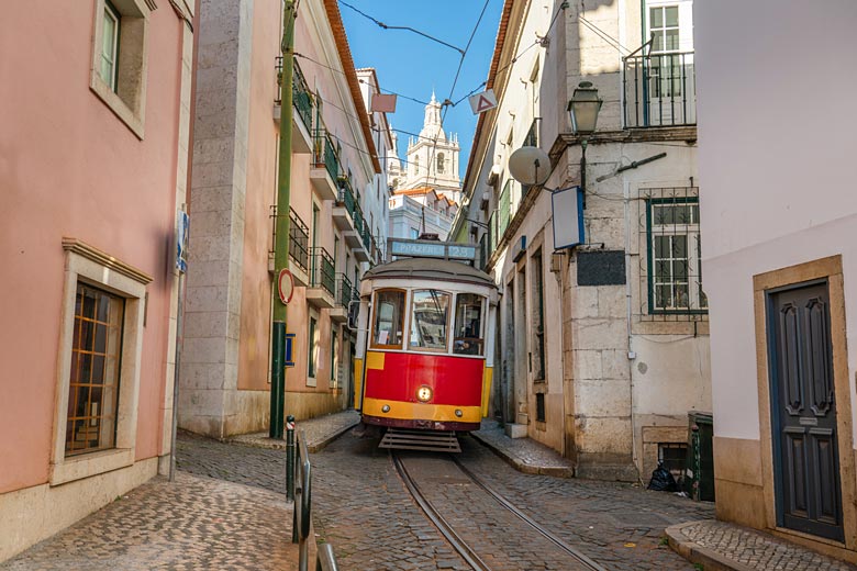 Tram 28 negotiating the narrow streets of Alfama, Lisbon