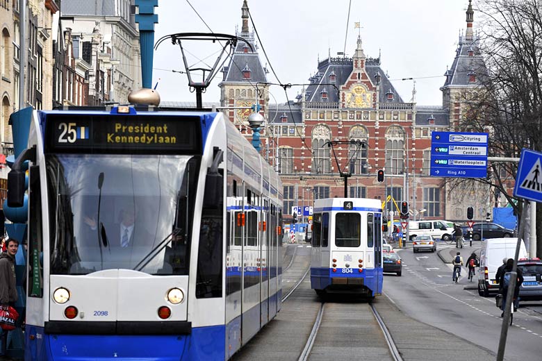 Trams on the Damrak, Amsterdam Trams on the Damrak, Amsterdam