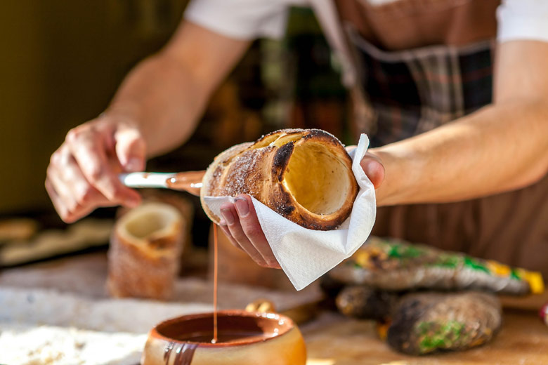 Chocolate-coated chimney cake or trdelník Chocolate-coated chimney cake or trdelník