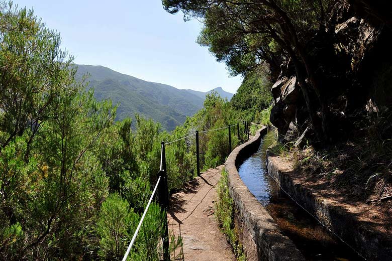 Typical Madeiran levada path with handrail Typical Madeiran levada path with handrail