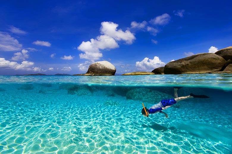 Young boy snorkelling in a warm clear tropical sea